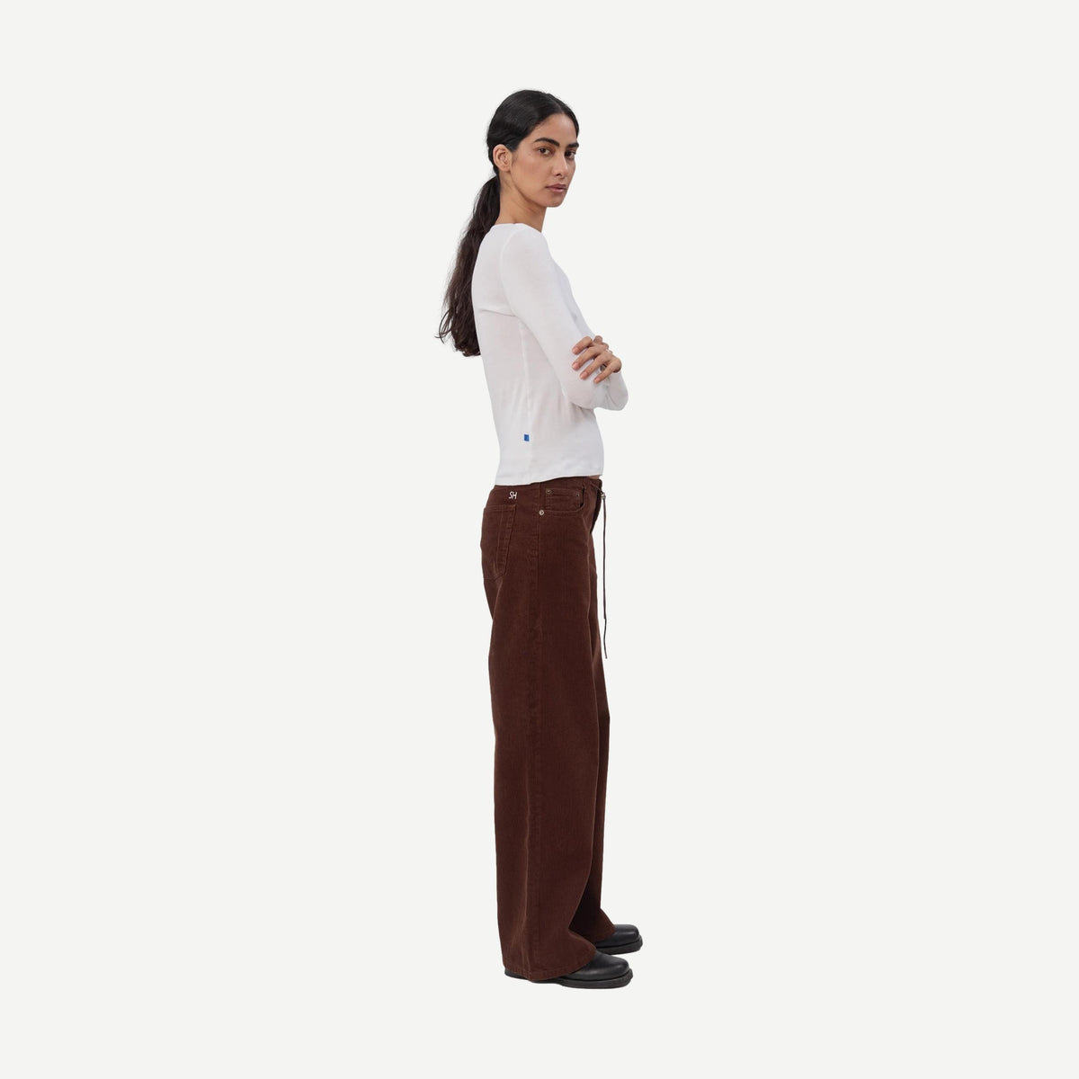 Still Here cool chocolate corduroy denim jeans, close-up of textured fabric and stylish fit.