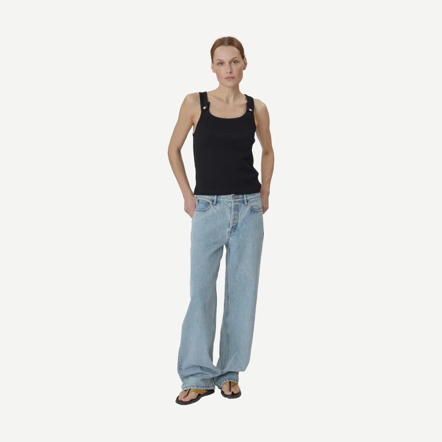 Still Here black Snap Tank top, sleeveless casual tank with a relaxed fit, shown on a model.