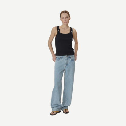 Still Here black Snap Tank top, sleeveless casual tank with a relaxed fit, shown on a model.