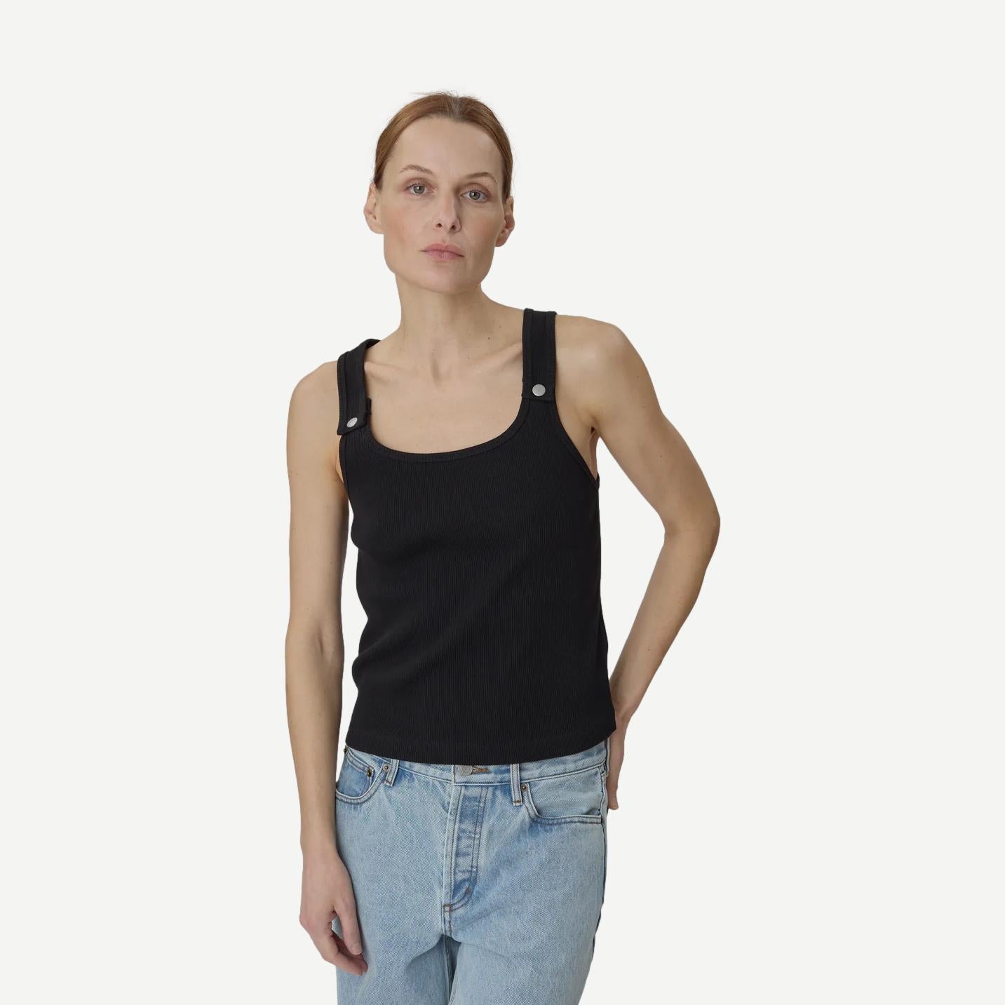 Still Here black Snap Tank top, sleeveless casual tank with round neckline, displayed on a plain background.