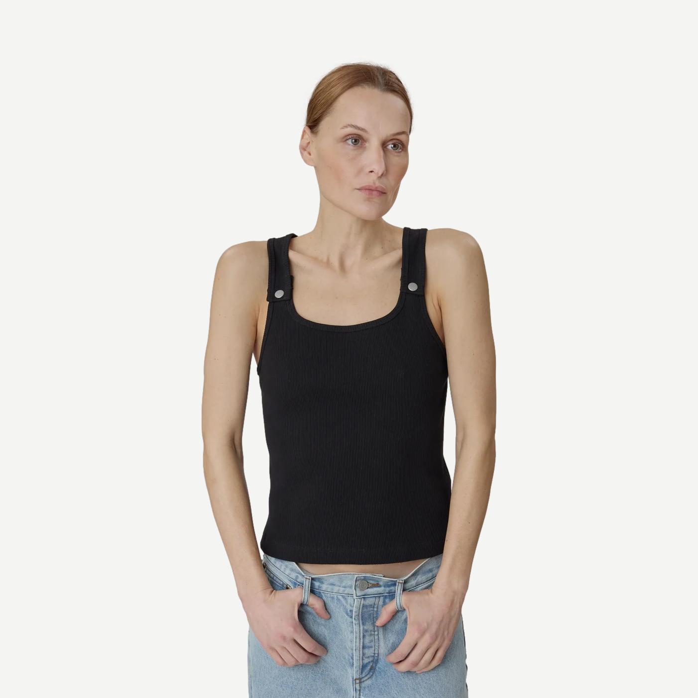 Still Here black Snap Tank top, sleeveless casual tank with a relaxed fit, shown on a model.