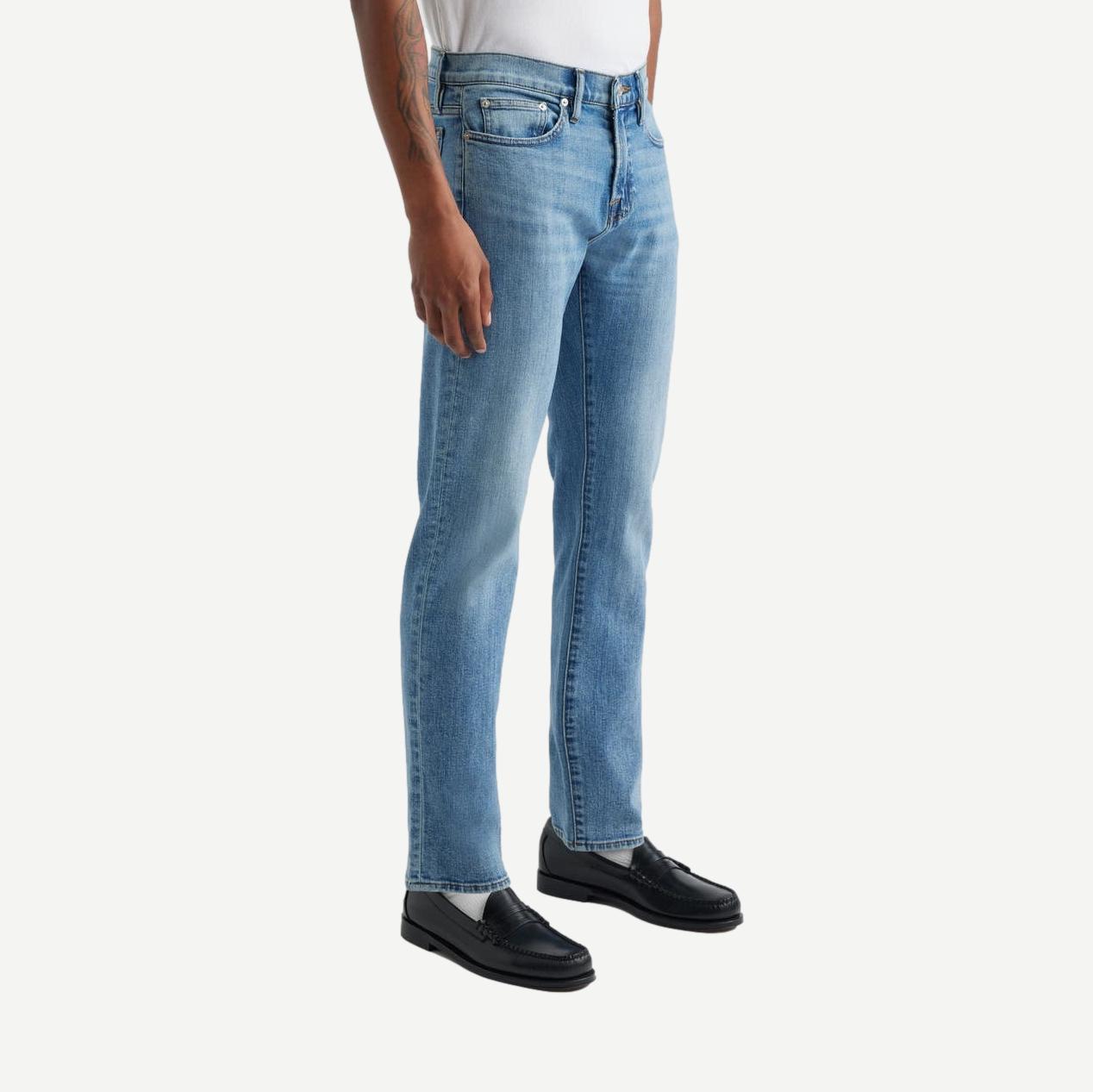 Frame Denim L'Homme Slim Jean in denim fabric, showcasing a fitted men's slim fit jean with classic stitching and five-pocket design.