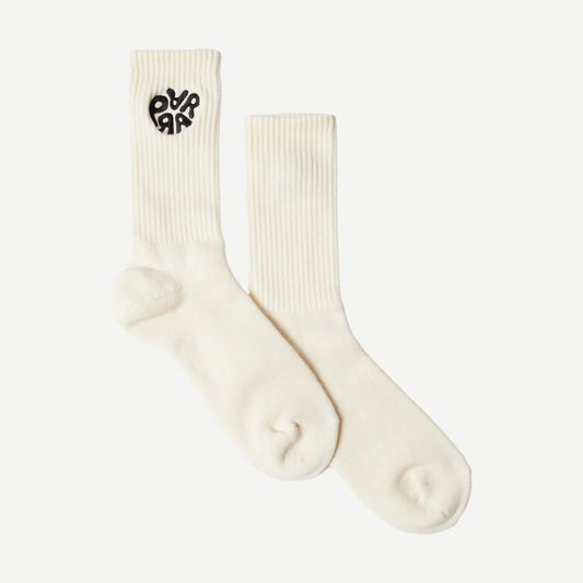 Off-white crew socks by By Parra featuring the 1976 logo design, made of soft, comfortable fabric for everyday wear.