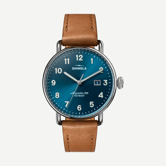 Shinola Canfield 3HD 38mm watch with astro blue dial and tan leather strap, showcasing its stylish and modern design.
