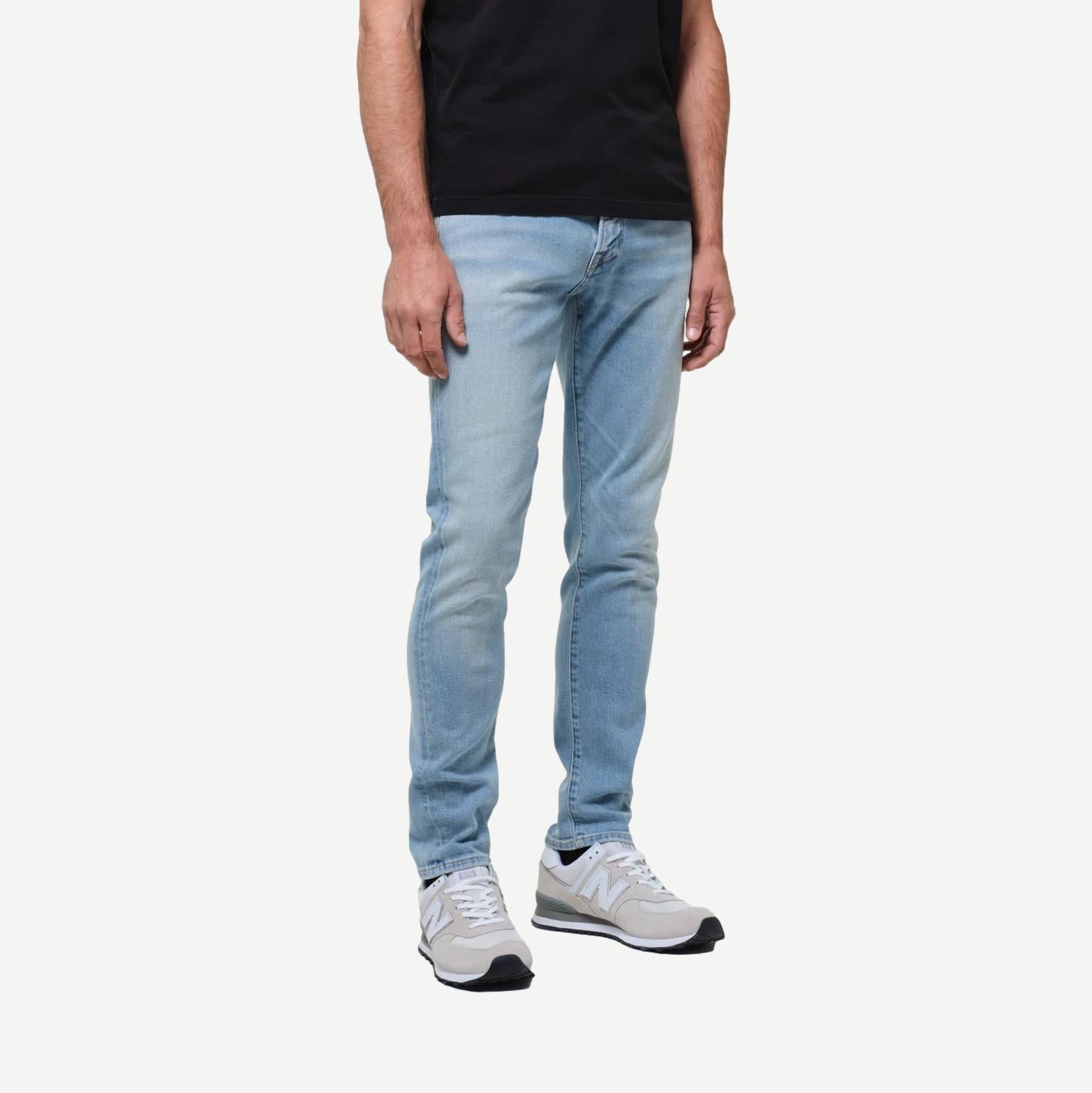 Citizens of Humanity London Light Wash denim jeans, slim fit with classic five-pocket design, shown on a model.