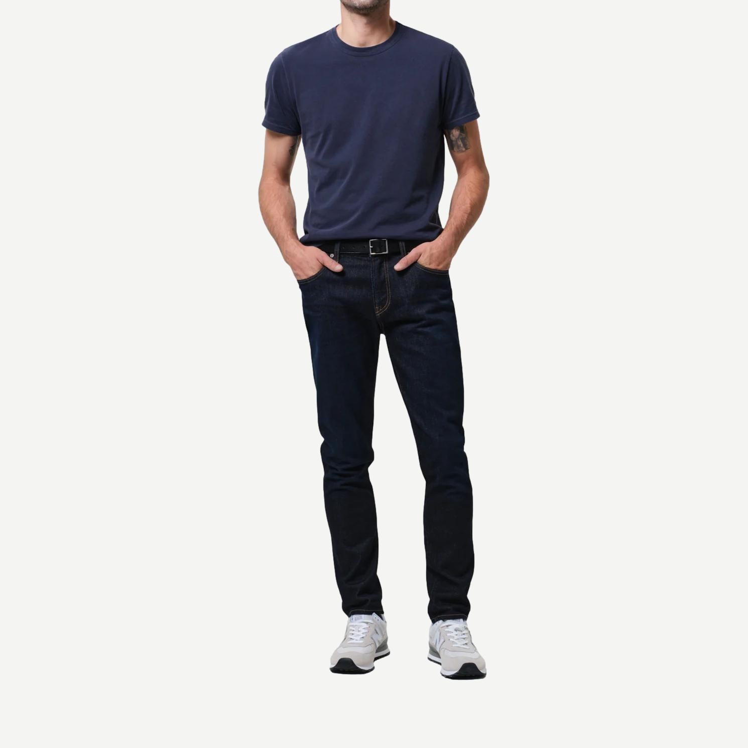 Citizens of Humanity London Cashmere Falcon denim jeans displayed on a hanger, showcasing classic blue denim with subtle fading.
