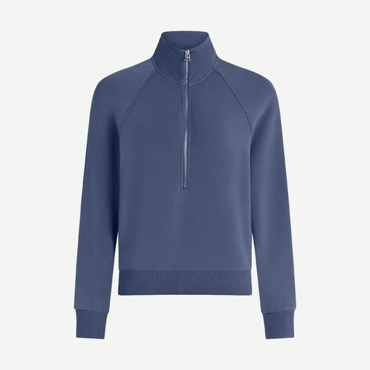Varley Selene half zip sweatshirt in Bijou Blue, featuring a relaxed fit and soft fabric, shown on a model.
