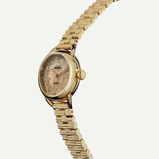 Shinola Runabout 3H 25mm watch with Petoskey stone dial and gold band, showcasing a sleek, modern timepiece with a polished finish.