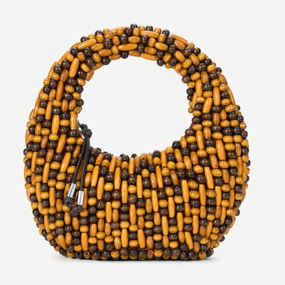Staud Reef Bag with multi wood beads purse featuring a woven design and floral accents, showcasing its stylish and handcrafted details.