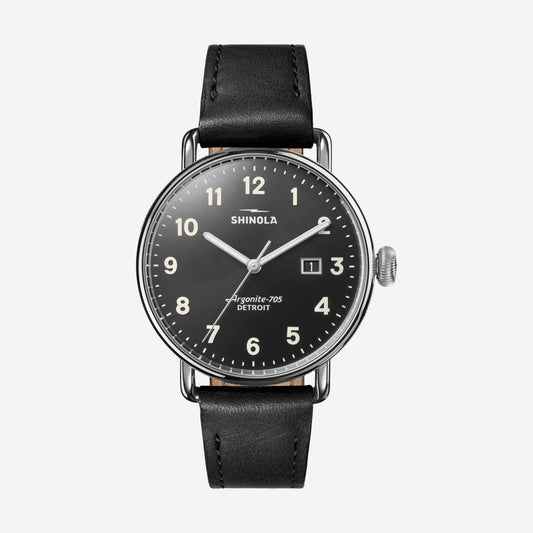 Shinola Canfield 3HD 38mm black watch with black leather strap, showcasing its sleek dial and stylish design.