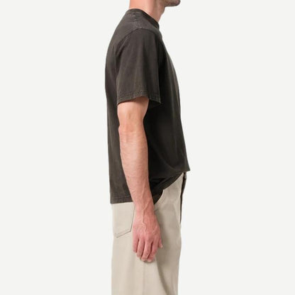 A woman wearing the Agolde Asha Mock Neck Tee in fracture color, close-up of the stylish, fitted T-shirt with mock neck design.