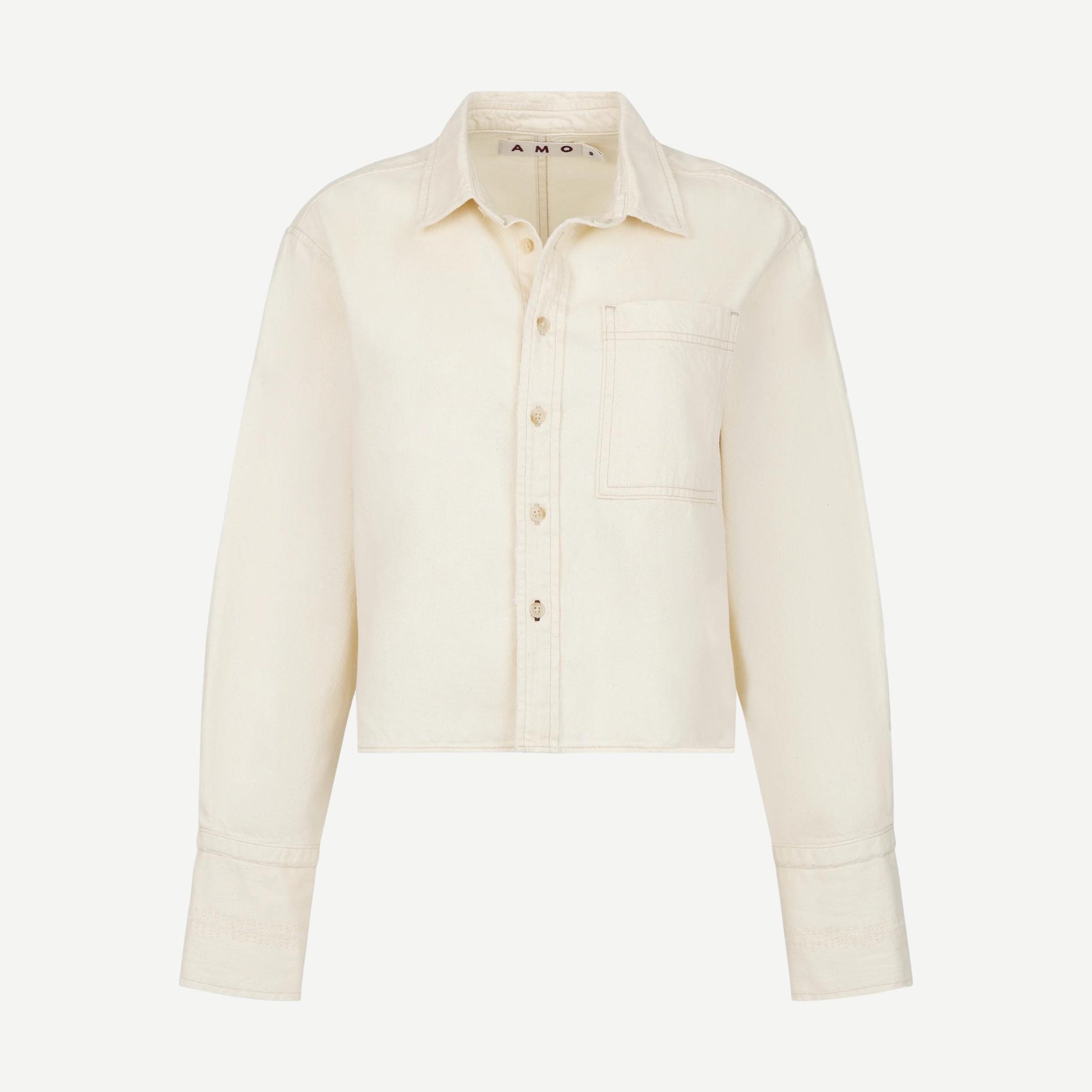 AMO Abigail long-sleeve shirt in bone color, soft fabric with a relaxed fit and classic collar, shown on a hanger.