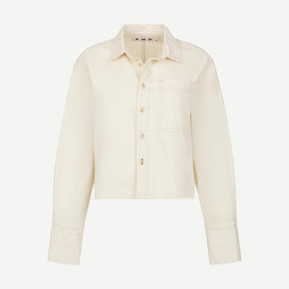 AMO Abigail long-sleeve shirt in bone color, soft fabric with a relaxed fit and classic collar, shown on a hanger.