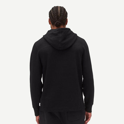 Black lightweight waffle hoodie from Reigning Champ, featuring a relaxed fit and classic sweatshirt style.