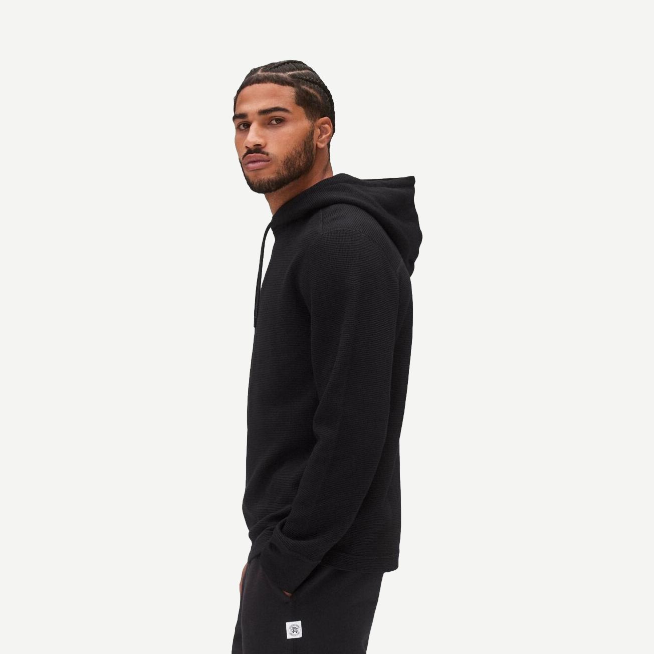 Black lightweight waffle hoodie by Reigning Champ, a comfortable sweatshirt with a relaxed fit and casual style.