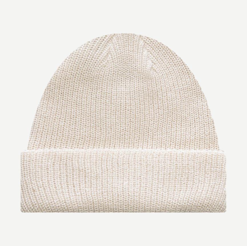 Stussy Basic Cuff Beanie in Cloud color, soft knit fabric, snug fit, and rolled cuff design, ideal for casual winter wear.