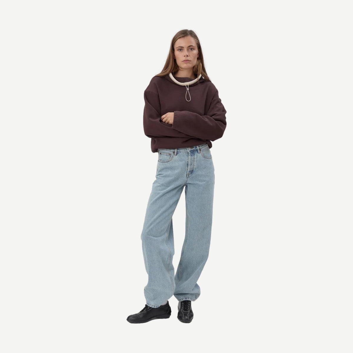Still Here chocolate brown Rec Pullover sweatshirt showing a cozy, casual fit with ribbed cuffs and neckline.