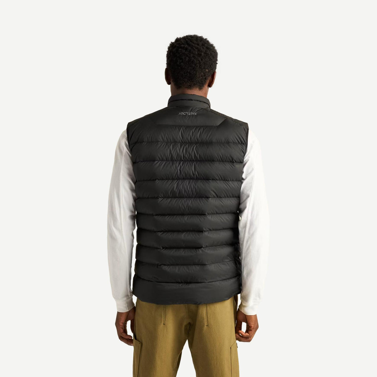 Black Cerium Vest for men by Arcteryx, showing the back view of the lightweight, insulated outdoor outerwear.