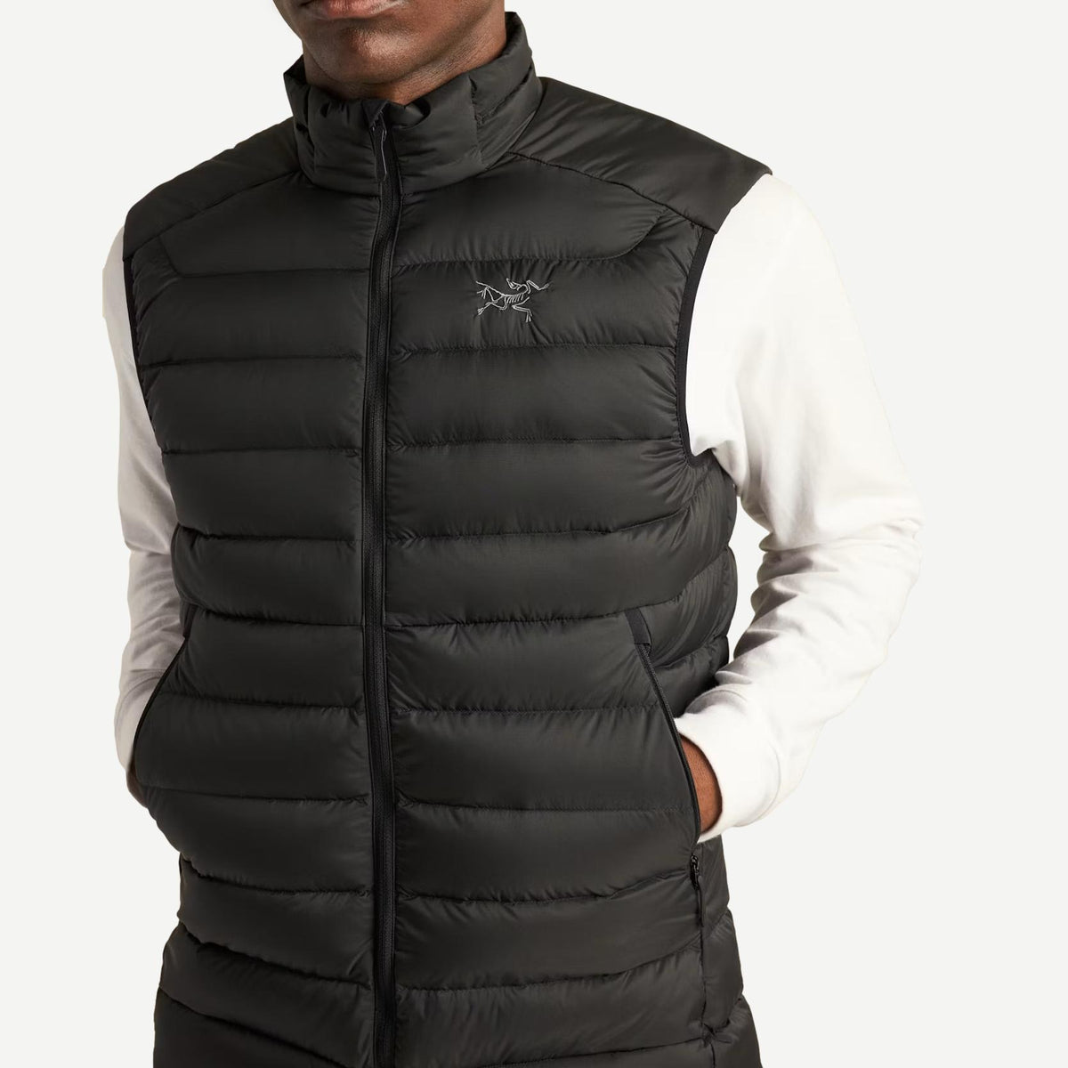 Men's black Cerium Vest by Arc'teryx, lightweight outerwear with a sleek design, shown in close-up detail.