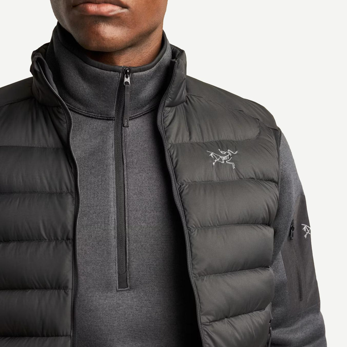 Black Arcteryx Cerium Vest men's outerwear with close-up fabric detail, lightweight and insulated for outdoor activities.