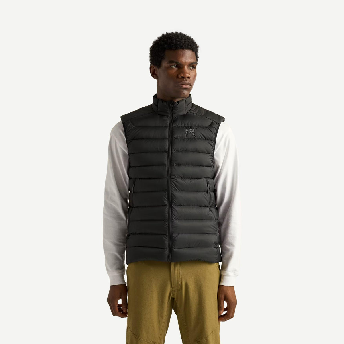 Black Arcteryx Cerium Vest men's outerwear displayed from the front view, showcasing its sleek design and lightweight insulation.