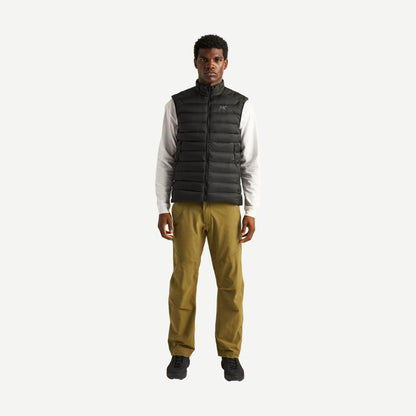 Black Arcteryx Cerium Vest men's outerwear, lightweight insulated vest with full zipper and high collar, shown on a model.