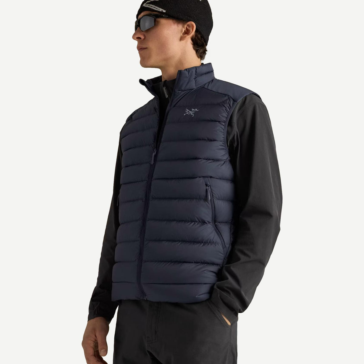 Men's Arcteryx Cerium Vest in black sapphire, featuring a lightweight insulated design with a sleek, fitted silhouette.