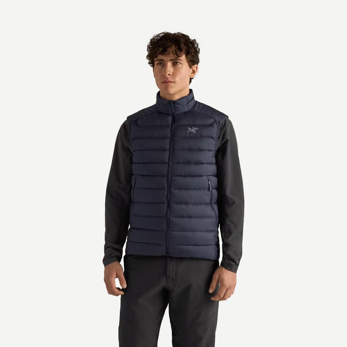 Black Arcteryx Cerium Vest for men with a sleek front view, showcasing lightweight insulation and a smooth, durable fabric exterior.