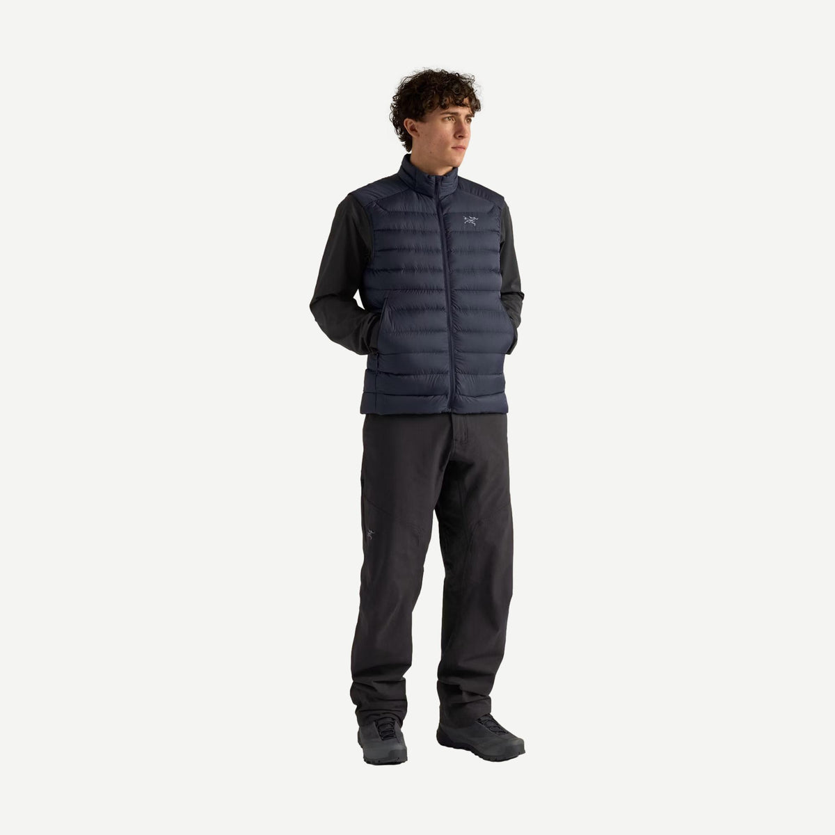 Men's Arcteryx Cerium Vest in black sapphire, lightweight insulated vest with a sleek design and full-body view.
