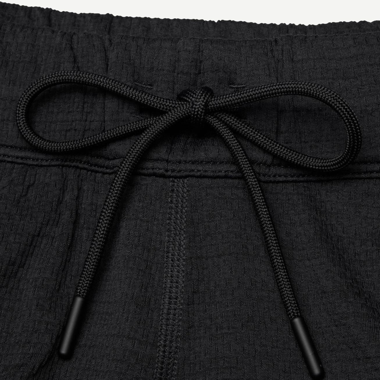 Reigning Champ Solotex Mesh Tiebreak Short 7-inch in black, lightweight athletic shorts with mesh fabric and a relaxed fit.