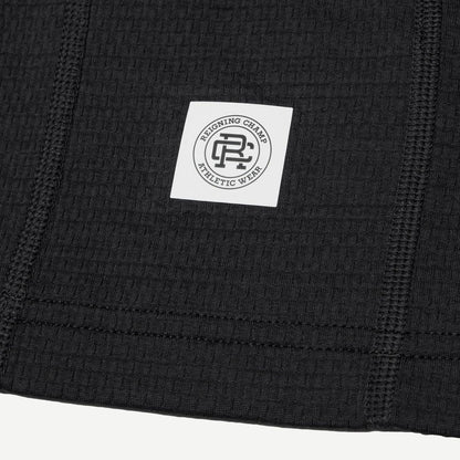 Reigning Champ Solotex Mesh Tiebreak Short 7-inch in black, featuring breathable mesh fabric and athletic fit.