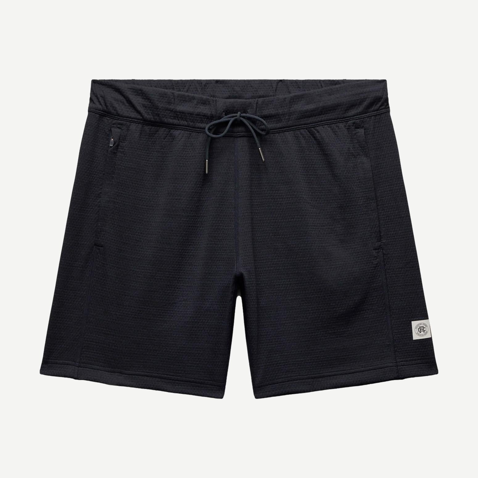 Reigning Champ navy Solotex mesh tiebreak short 7-inch length, lightweight athletic shorts with mesh fabric and elastic waistband.