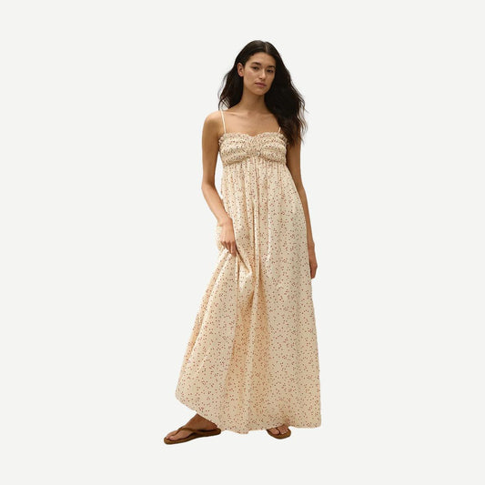 Faithfull The Brand Presa Maxi Dress in Linnea Dot Panna with a flowing silhouette and dotted pattern, shown on a model.