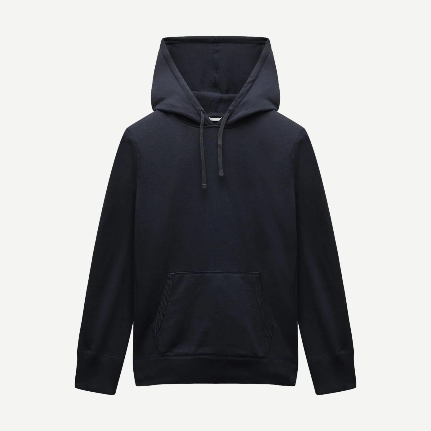 Reigning Champ navy midweight terry slim hoodie, sweatshirt style, shown on a model with a relaxed fit and minimal design.
