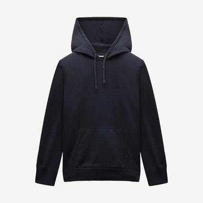 Reigning Champ navy midweight terry slim hoodie, sweatshirt style, shown on a model with a relaxed fit and minimal design.