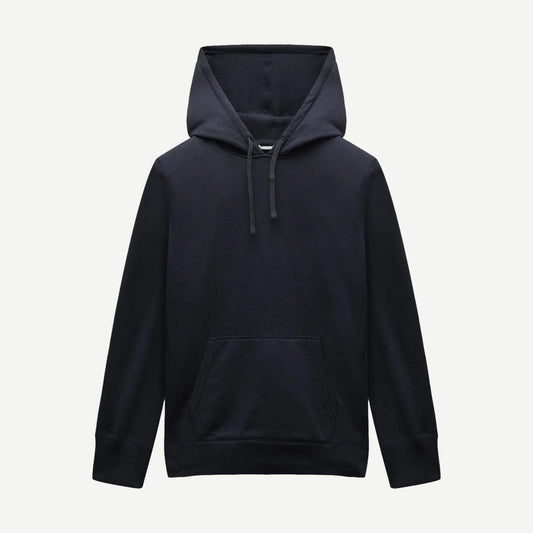 Reigning Champ navy midweight terry slim hoodie, sweatshirt style, shown on a model with a relaxed fit and minimal design.