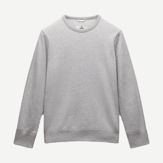 Reigning Champ men's midweight terry slim crewneck sweatshirt in Heather Grey, showing the relaxed fit and soft fabric.