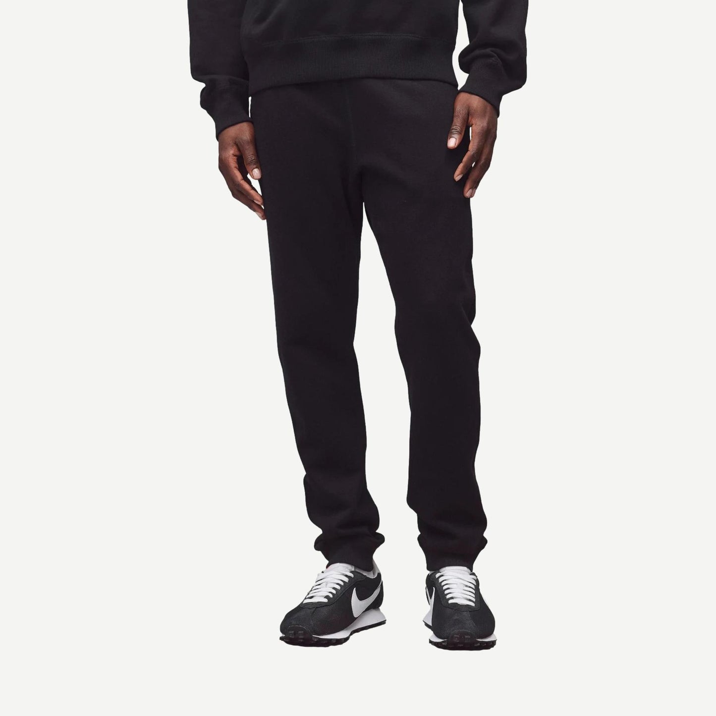 Black Reigning Champ midweight Terry Slim Sweatpant laid flat showing waistband and relaxed fit, ideal for casual wear.