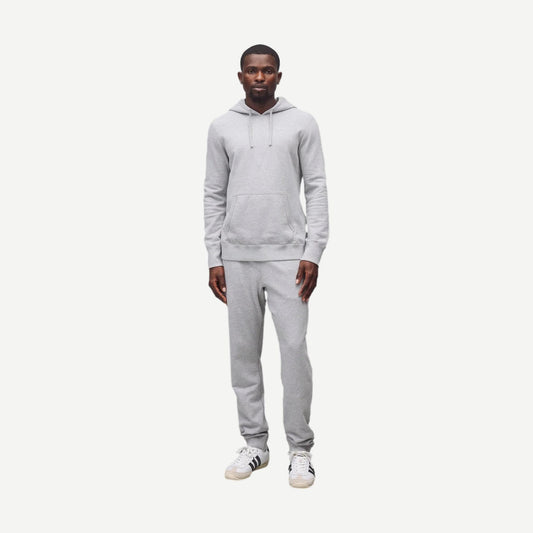 Reigning Champ midweight Terry slim sweatpants in Heather Grey, showing a close-up of the soft, comfortable fabric and slim fit design.