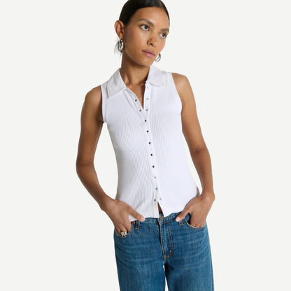 White Jaylin Polo Top by Nation LTD, featuring a classic collar and short sleeves, laid flat on a neutral background.