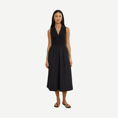 Jessica Midi Dress by Nation LTD in jet black, featuring a sleek, fitted silhouette and elegant midi length, worn by a model.