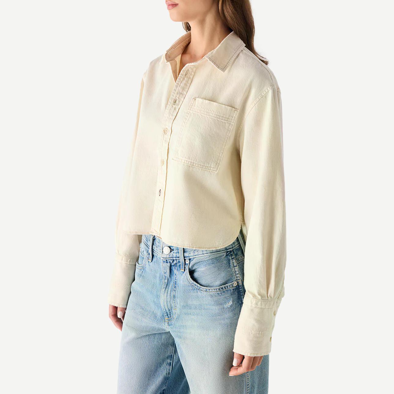 AMO Abigail long sleeve shirt in bone color, soft fabric, and classic fit, displayed on a hanger.