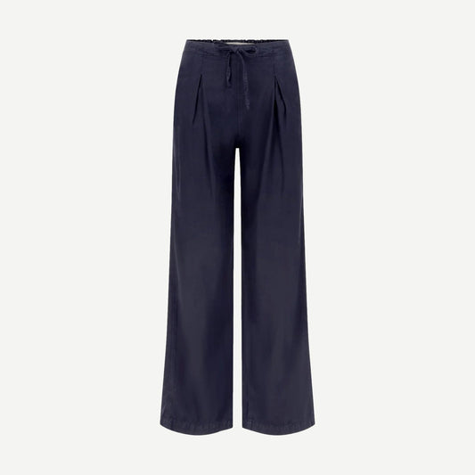 AMO Laurel Pant in Twilight color, stylish casual pants with relaxed fit and modern design, shown in a close-up shot.