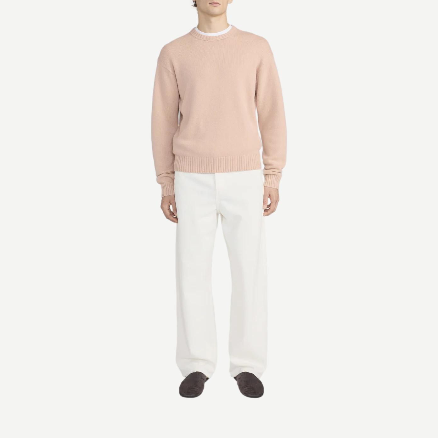 Pale peach cashmere crewneck sweater from Frame Denim, featuring a soft texture and classic silhouette.