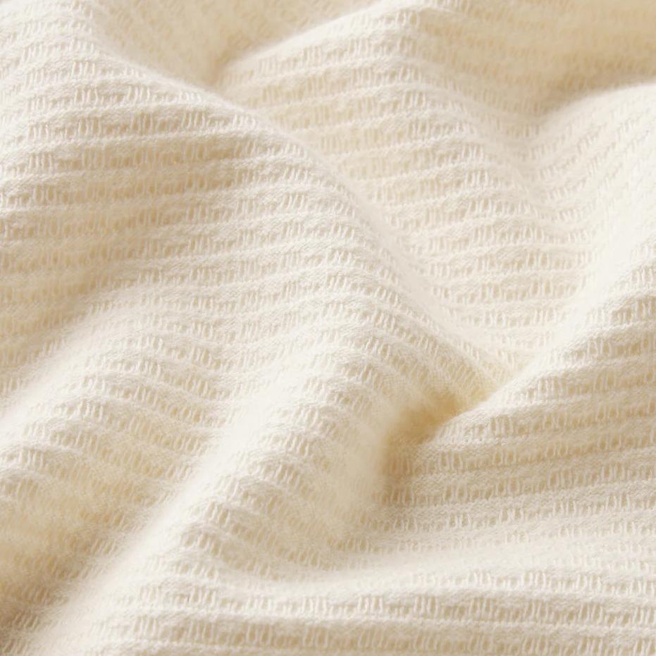 Cream Frame Denim Jacquard short-sleeve button-down shirt with intricate woven fabric detail.