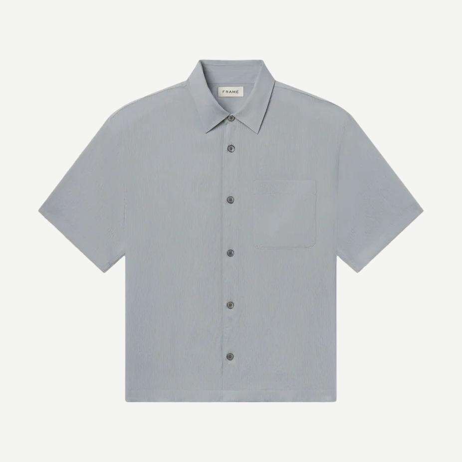 Blue grey striped lightweight short-sleeve button-up shirt by Frame Denim, shown folded with visible collar and button details.
