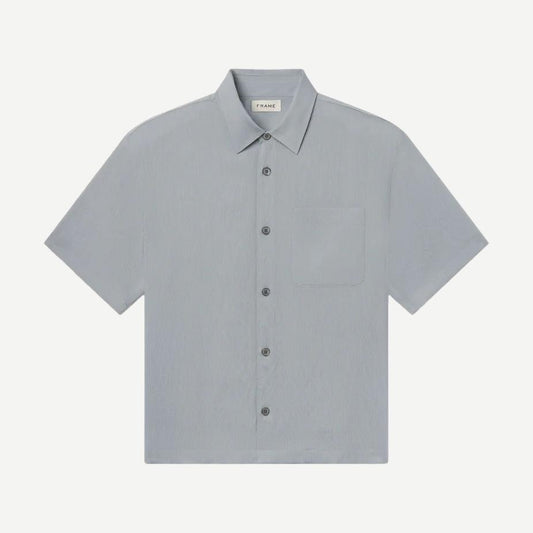 Lightweight blue grey stripe button-up shirt by Frame Denim, casual style with collar and long sleeves, laid flat.