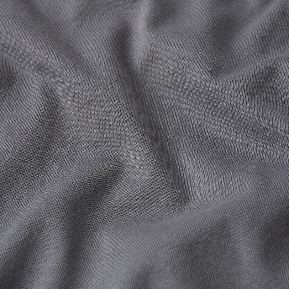 Light grey short-sleeve cotton T-shirt by Frame Denim, showing a close-up of the fabric and fit.
