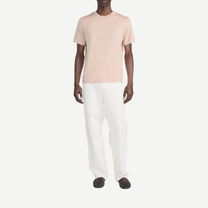 Light peach short-sleeve cotton T-shirt by Frame Denim, casual fit with soft fabric and simple crew neckline.