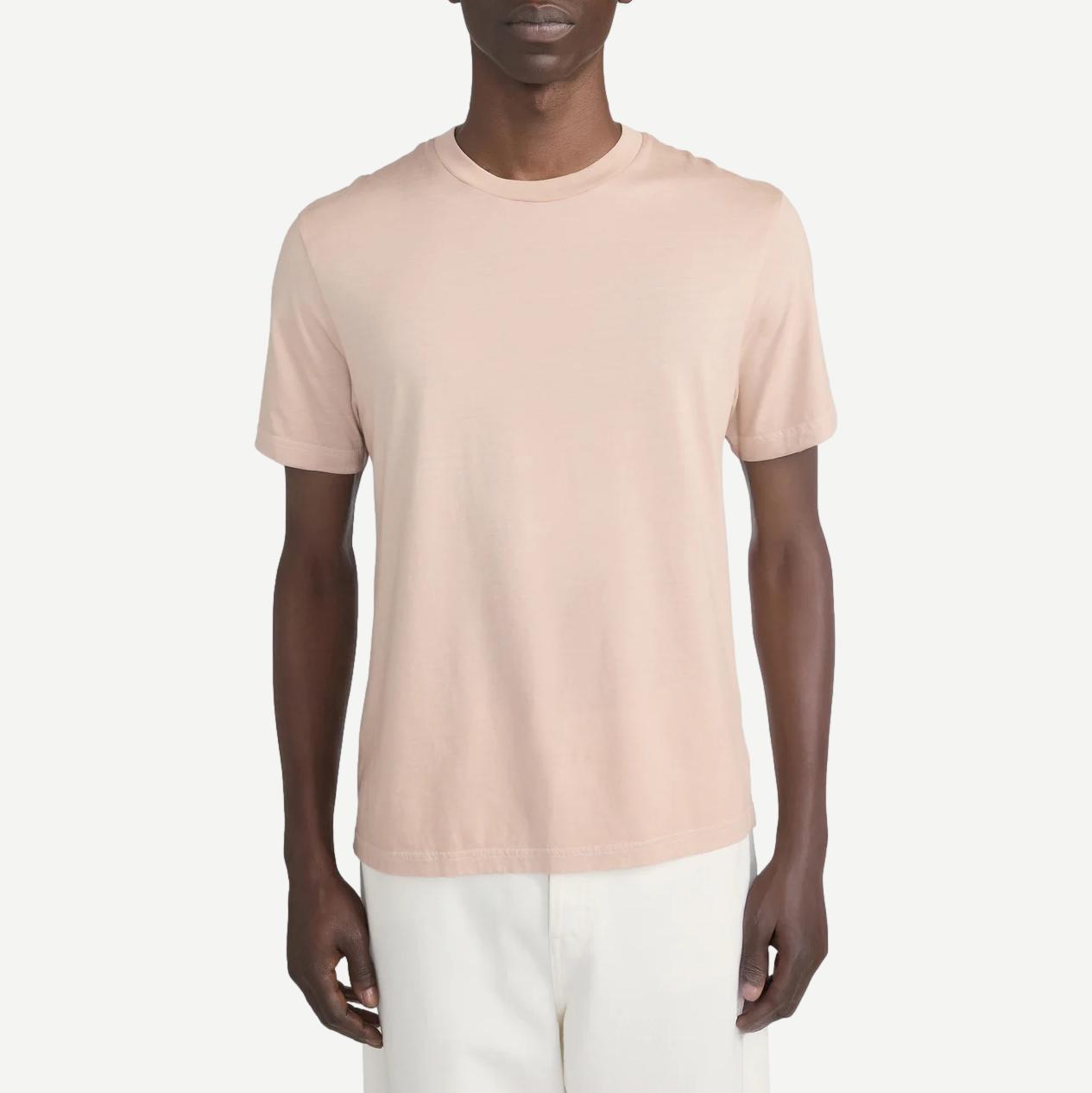 Light peach short-sleeve cotton T-shirt by Frame Denim, casual fit with round neckline and soft fabric, showcased on a plain background.